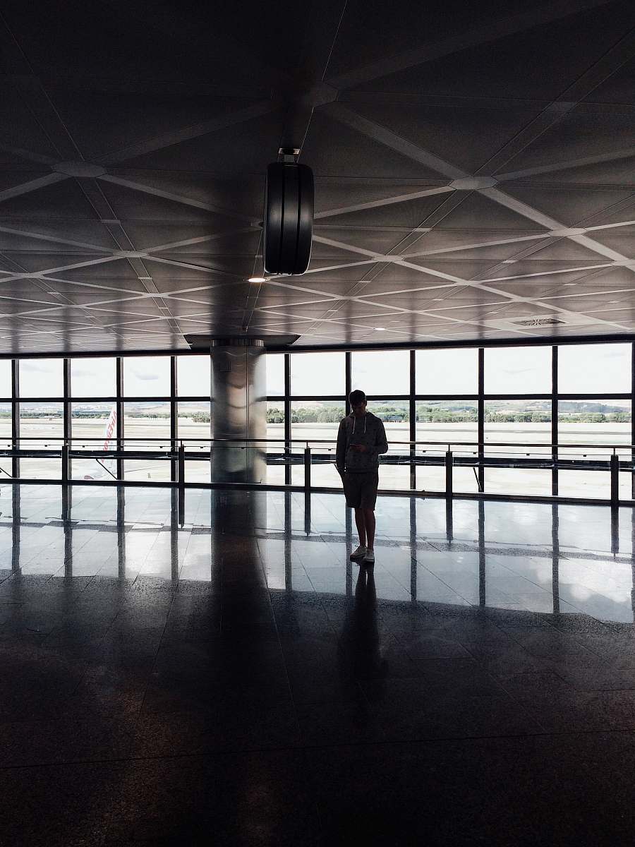 man silhouette photo of person inside building male