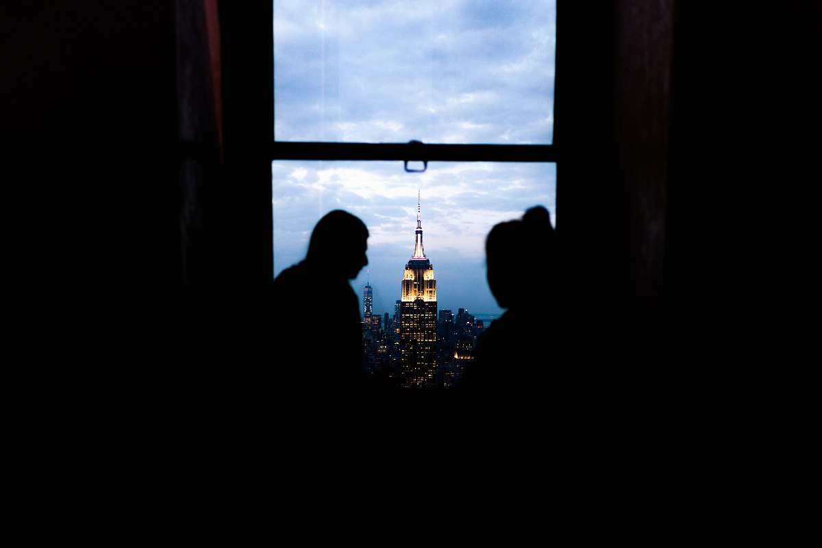 building picture of couple in window window