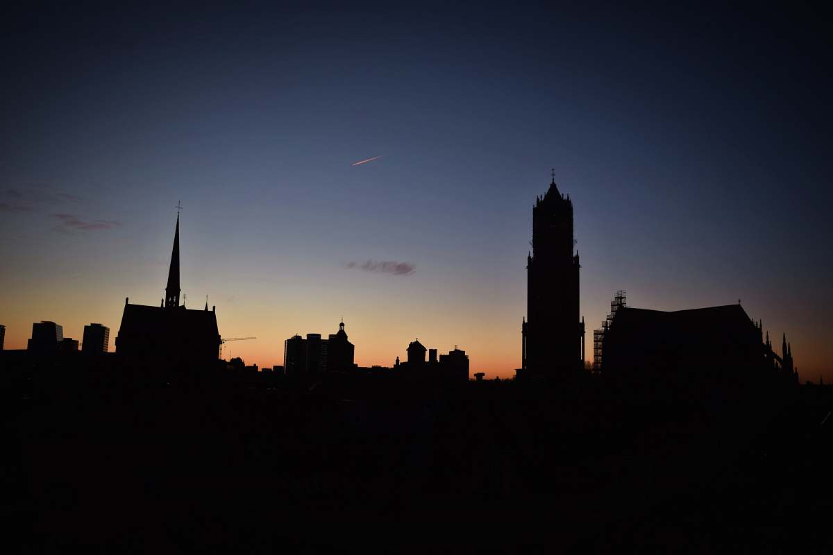 building silhouette of buildings under blue sky tower