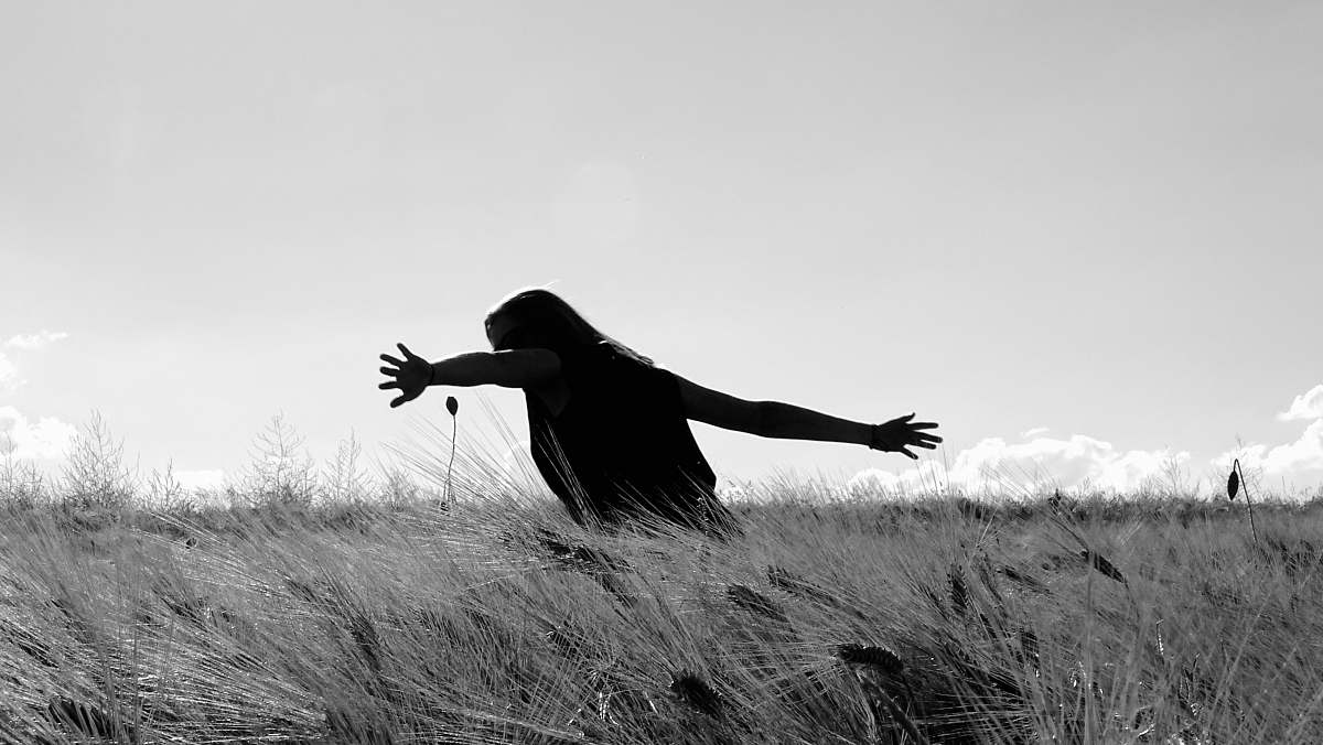black-and-white man standing on the field animal