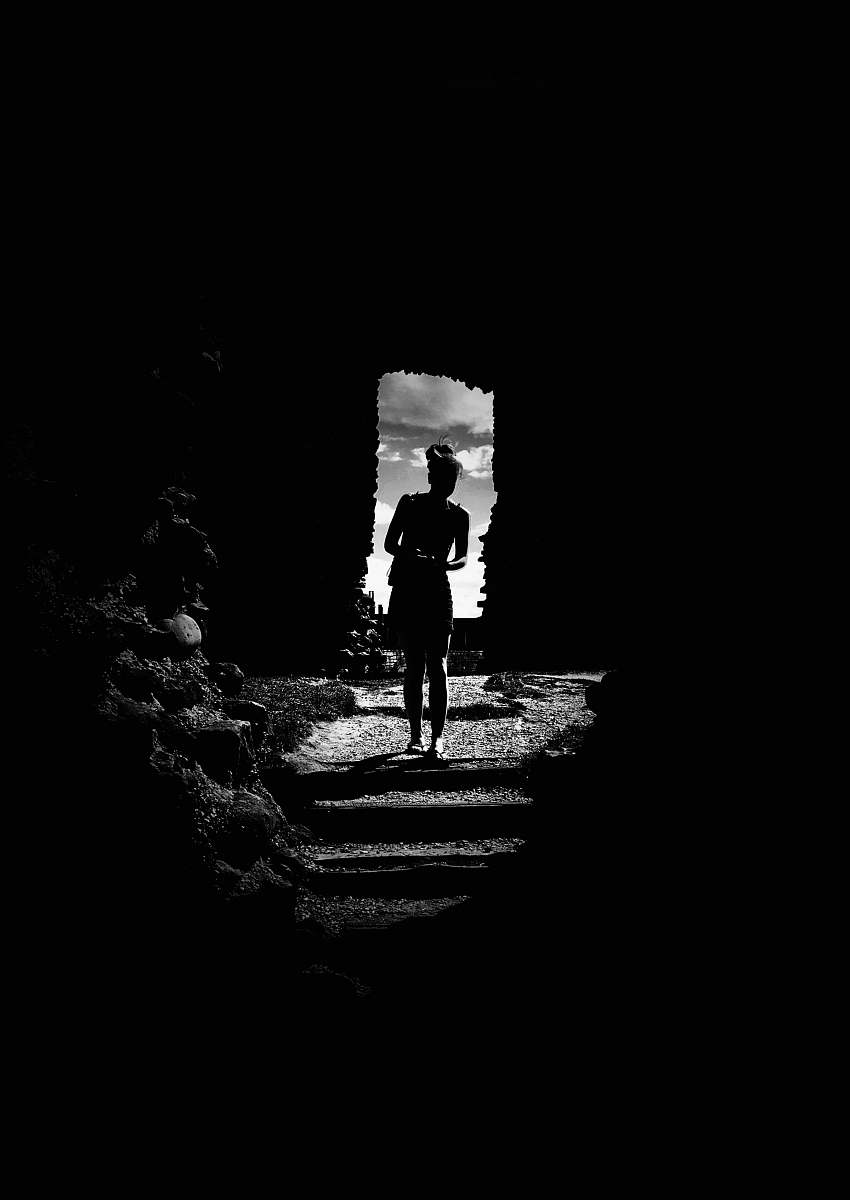 human grayscale photo of woman inside house person