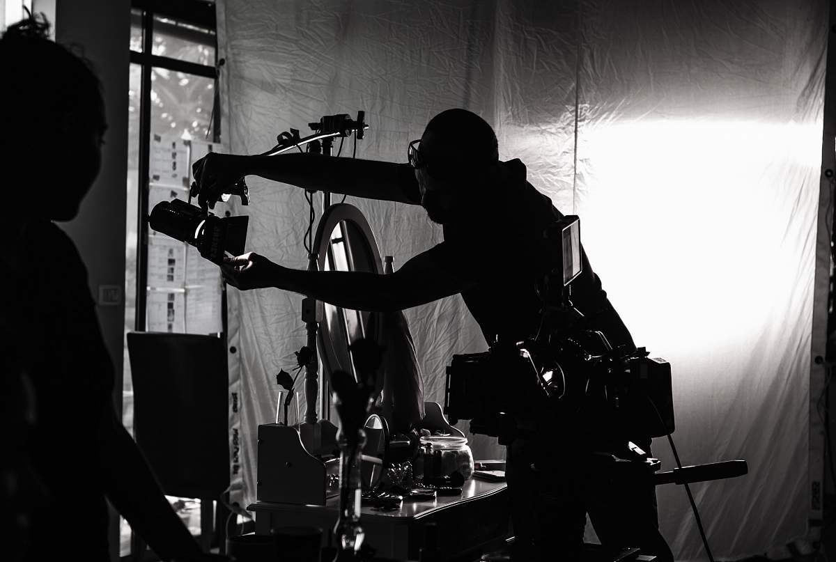 person silhouette of person holding camera human