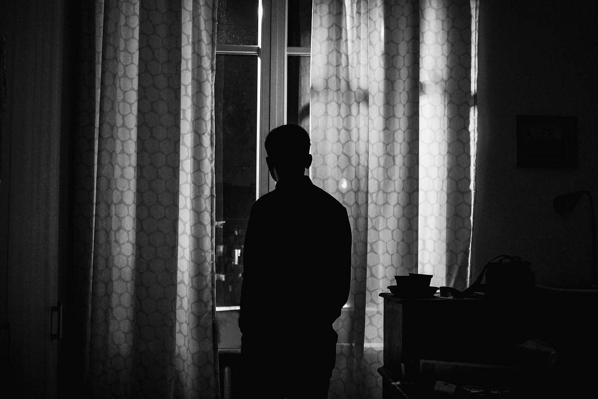 human silhouette of person standing inside room person