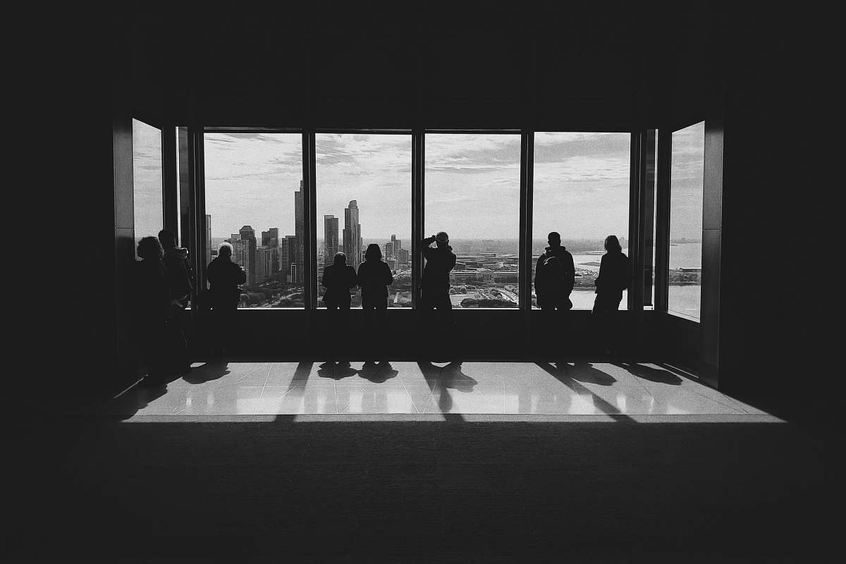 human silhouette photo of people standing beside of mirror person