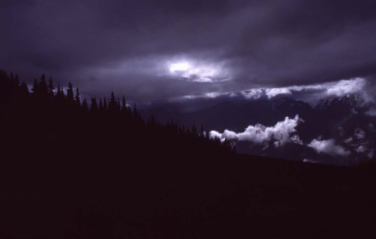 nature silhouette photo of mountain range with trees cloud