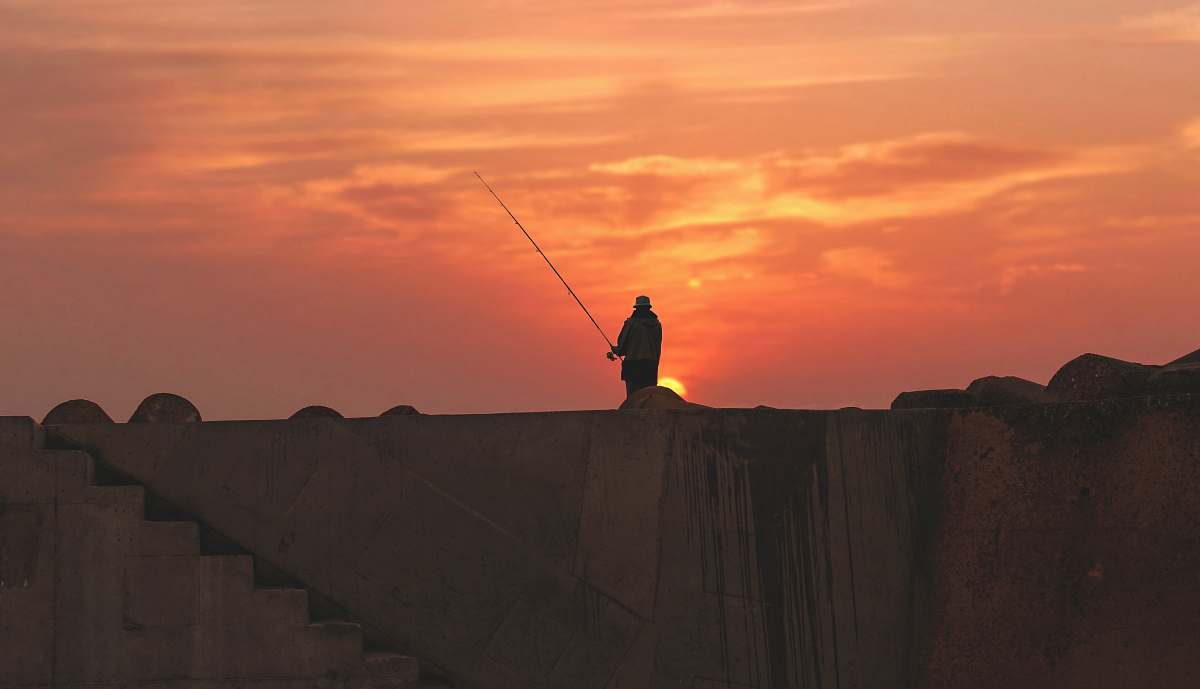 sun silhouette of person standing during golden hour man
