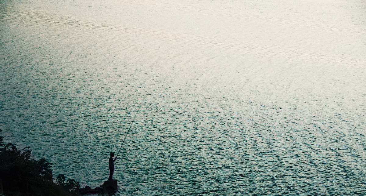 nature person stand on rock near body of water during daytime sea