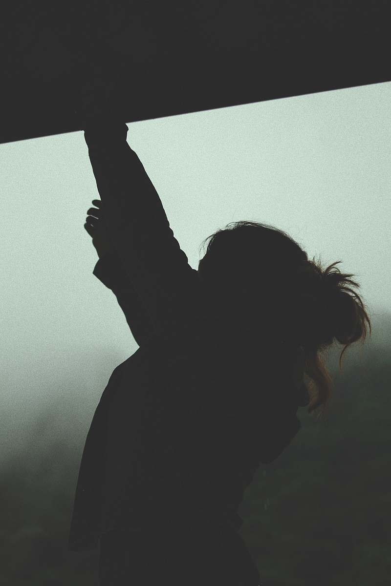 silhouette silhouette of woman reaching person