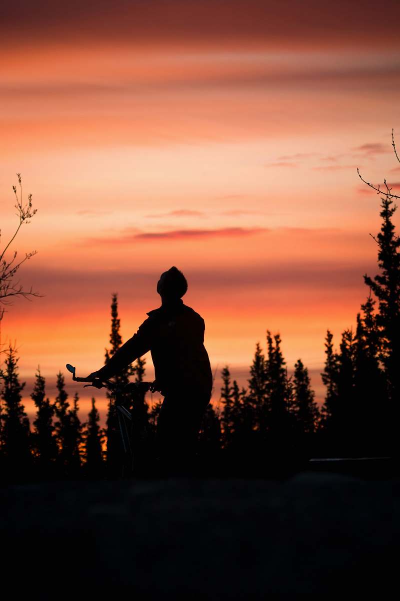 person man riding bike silhouette people