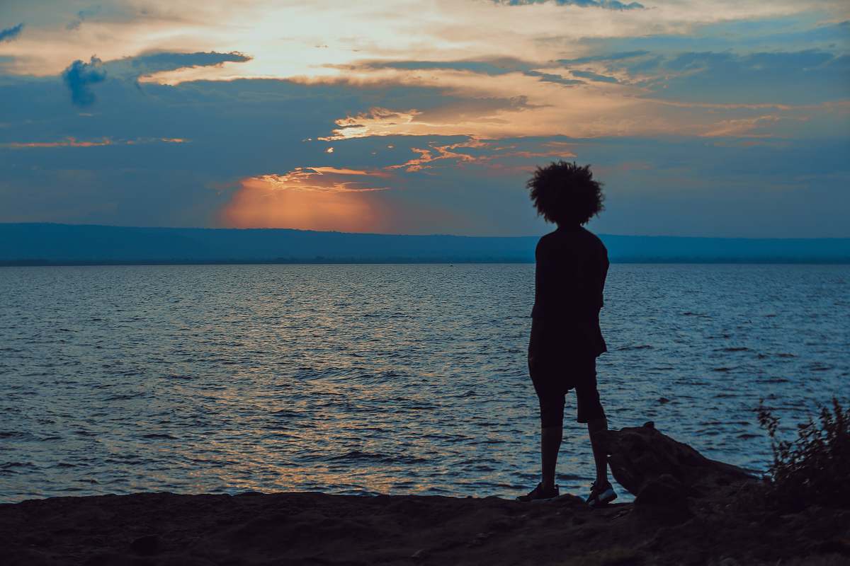 person man standing near shore people