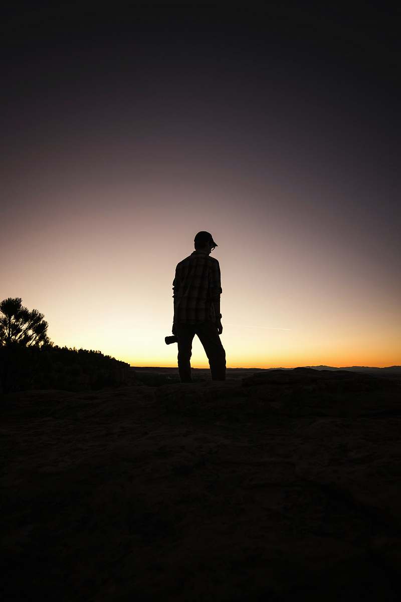 person man standing under white and black sky people