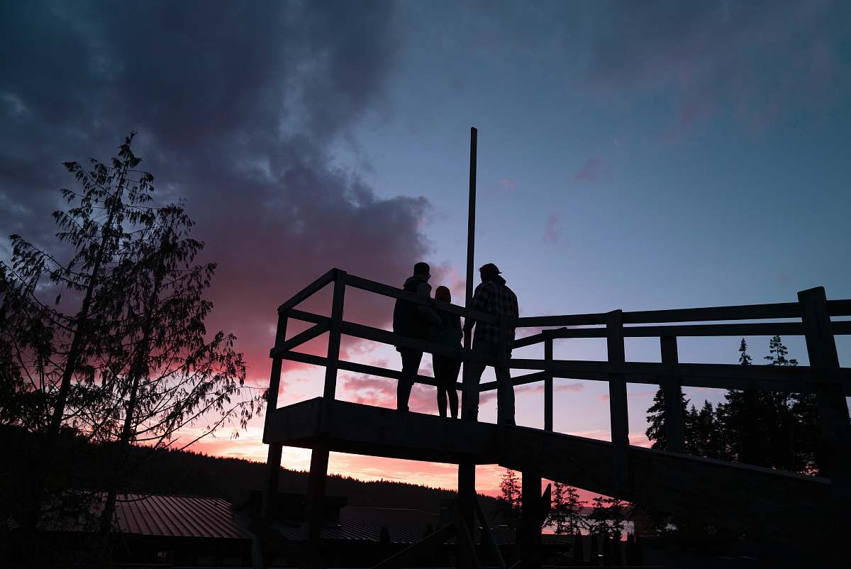 handrail people standing near tree banister
