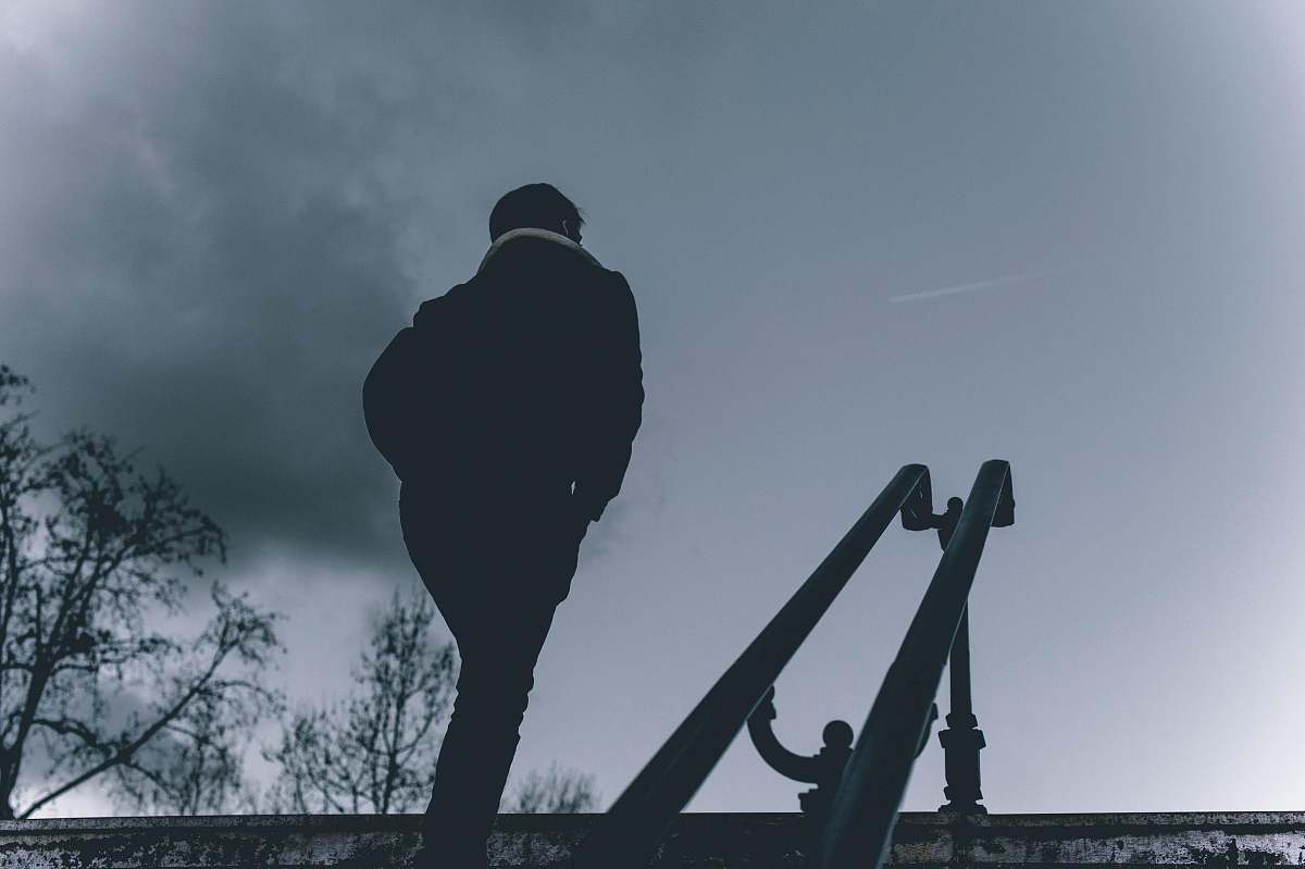 person person walk near two slide during nighttime silhouette