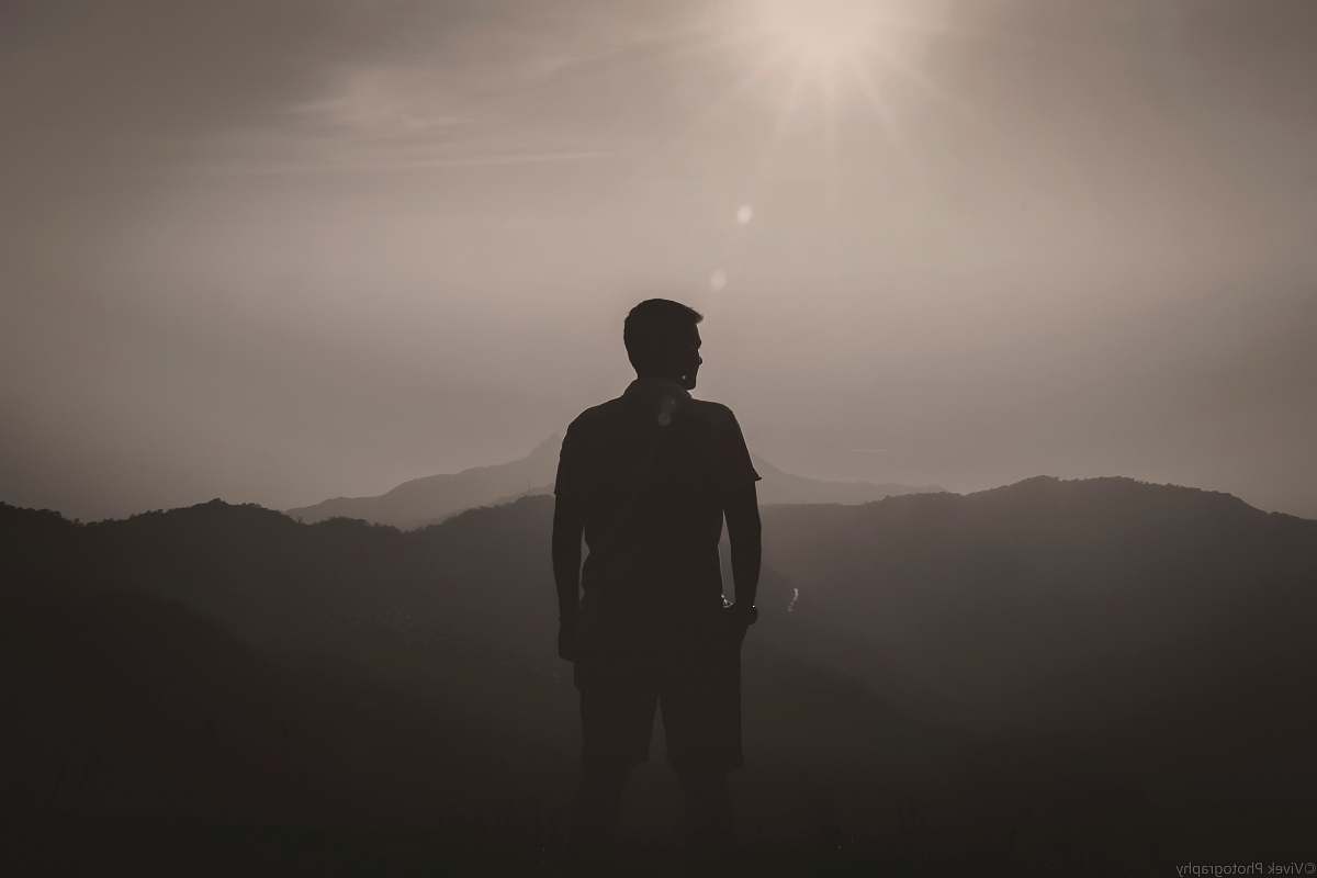 person silhouette of man looking towards left people