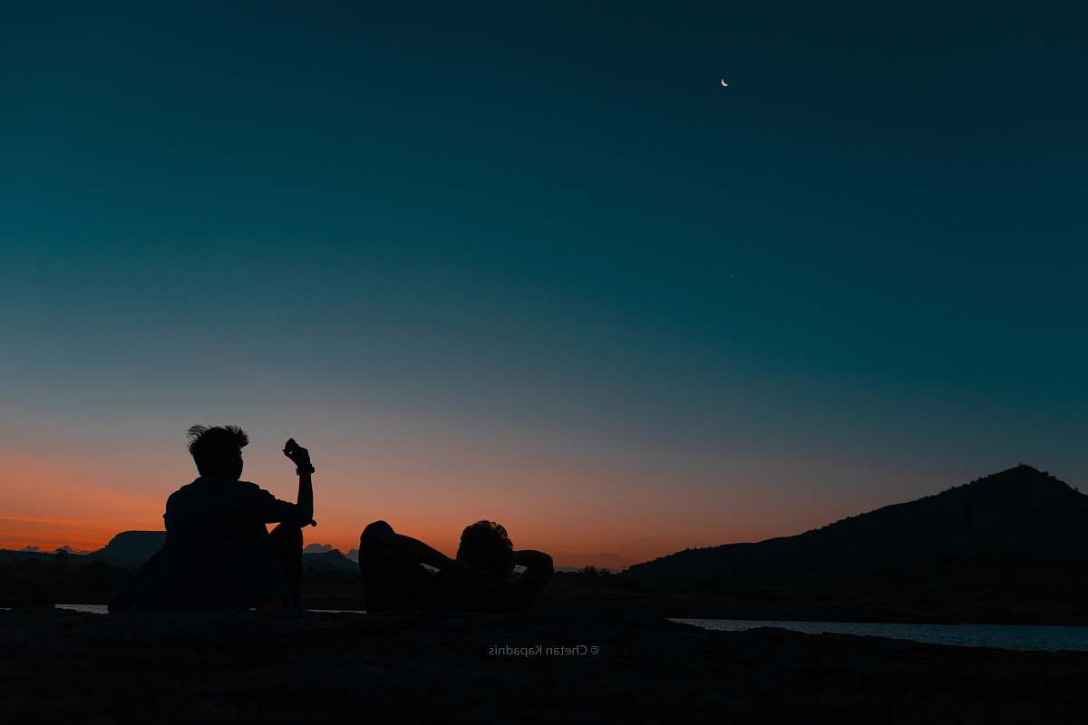 person silhouette of man with phone at dusk silhouette