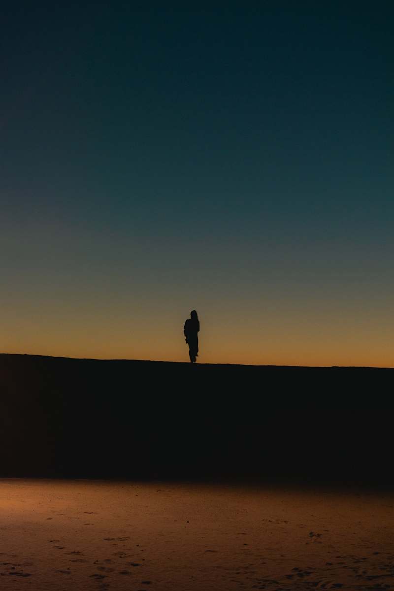 outdoors silhouette of person standing on black surface nature