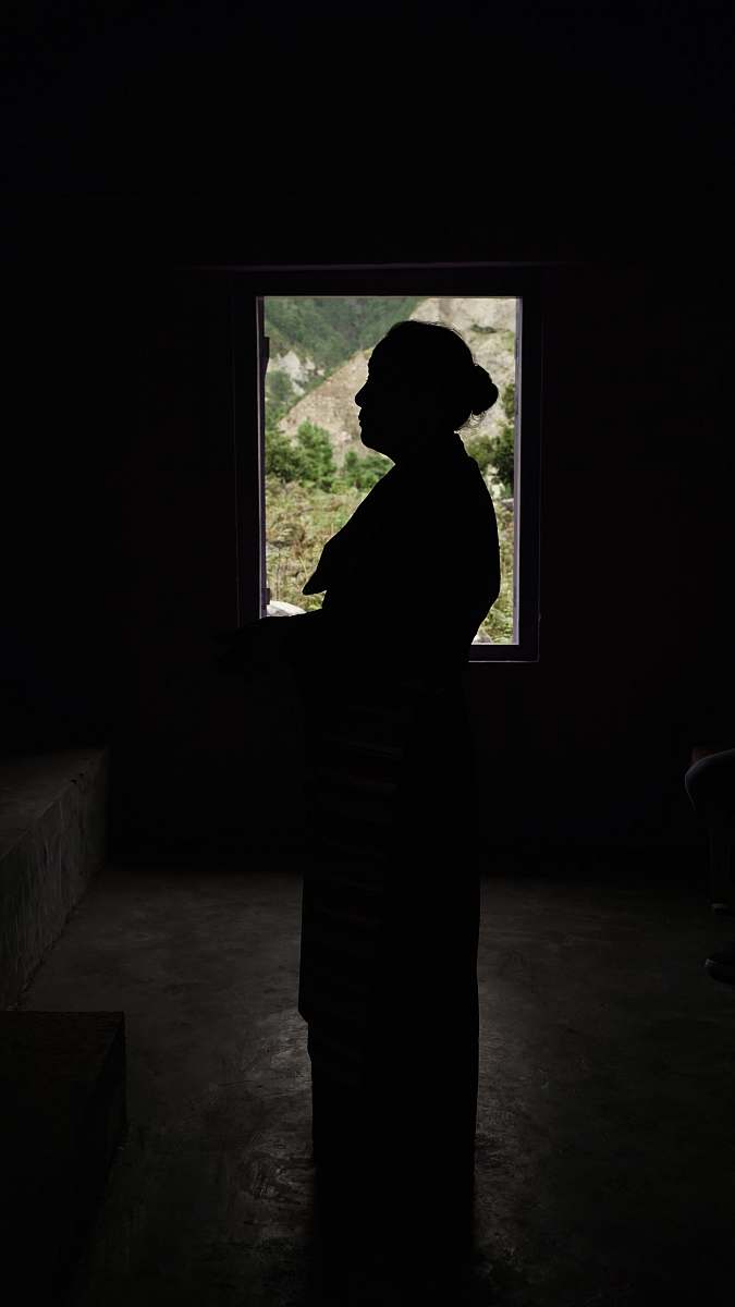 person silhouette of woman standing inside room people
