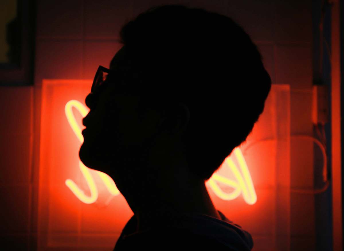 person silhouette photo of man wearing sunglasses people