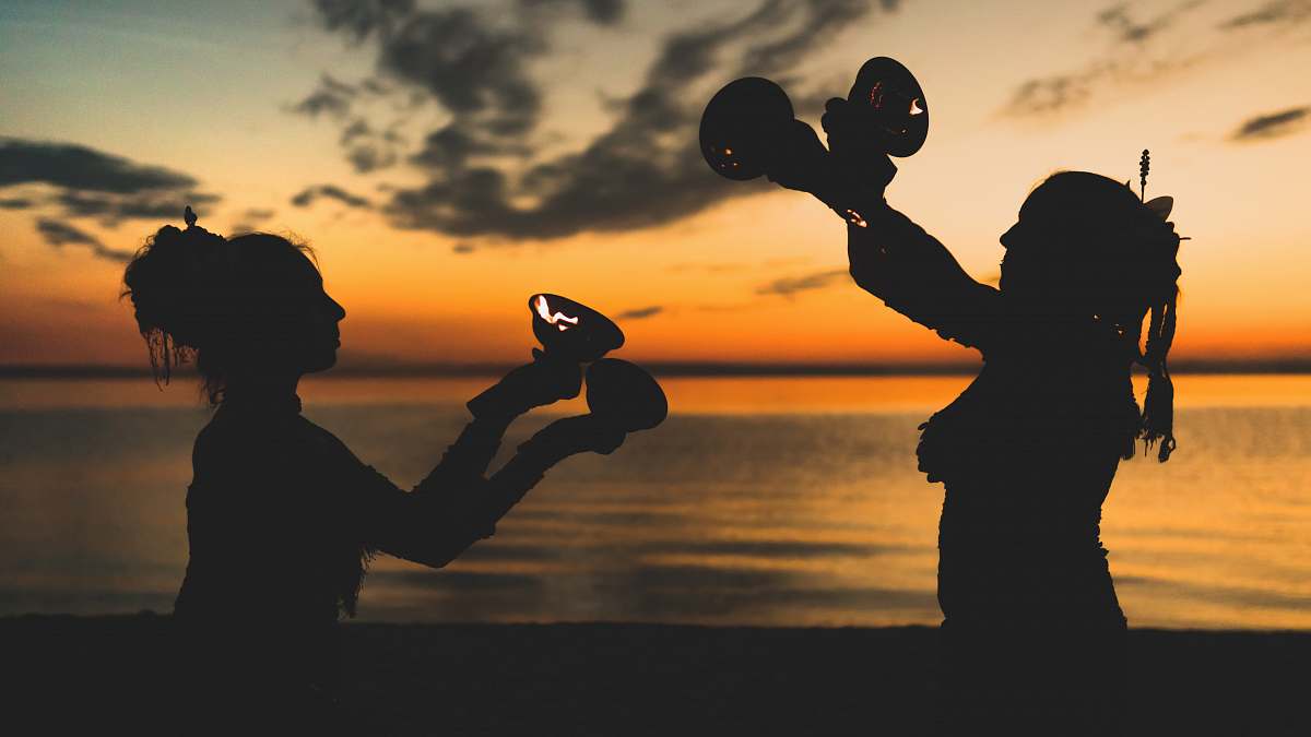 person two women's silhouette near beach people