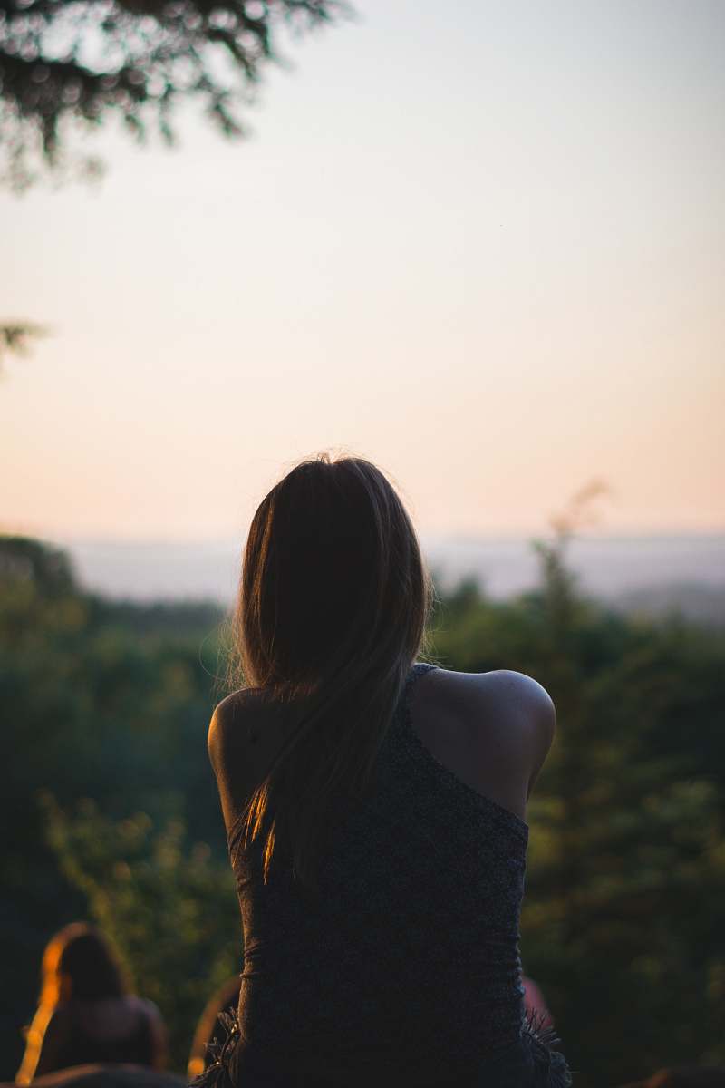 person woman looking at forest back