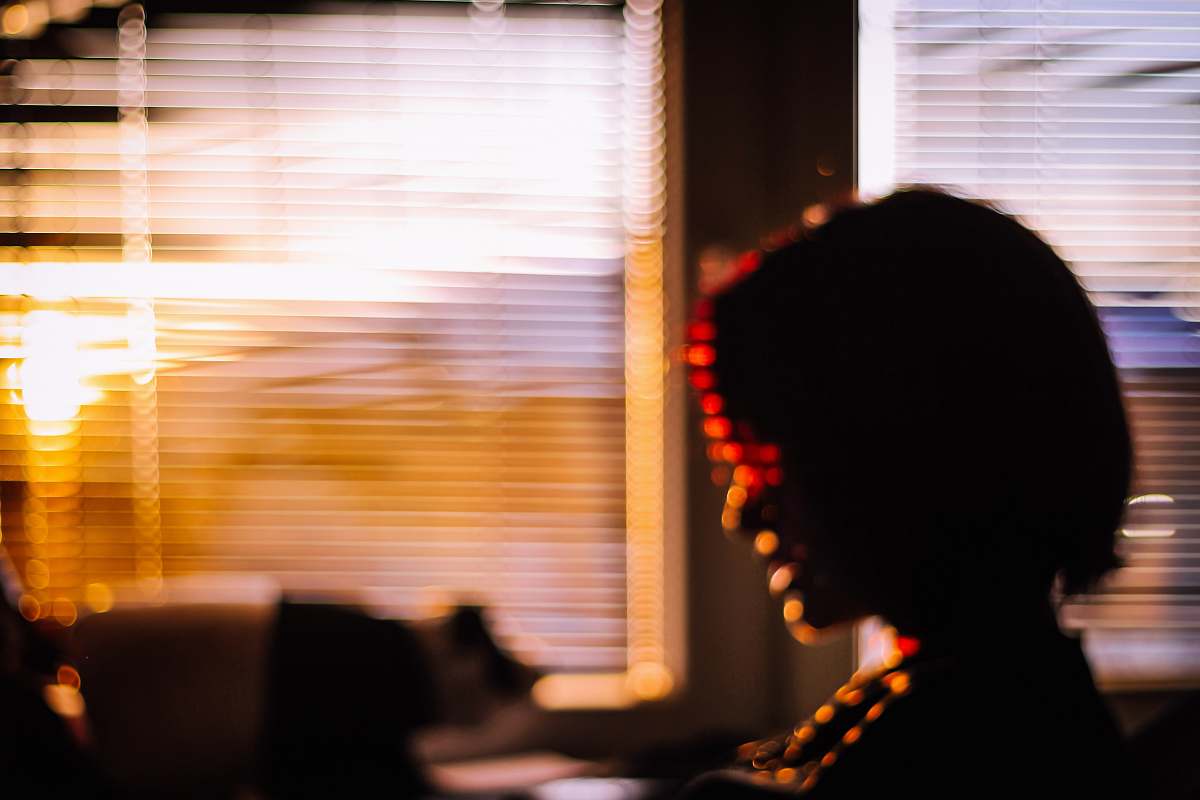person woman near window home decor