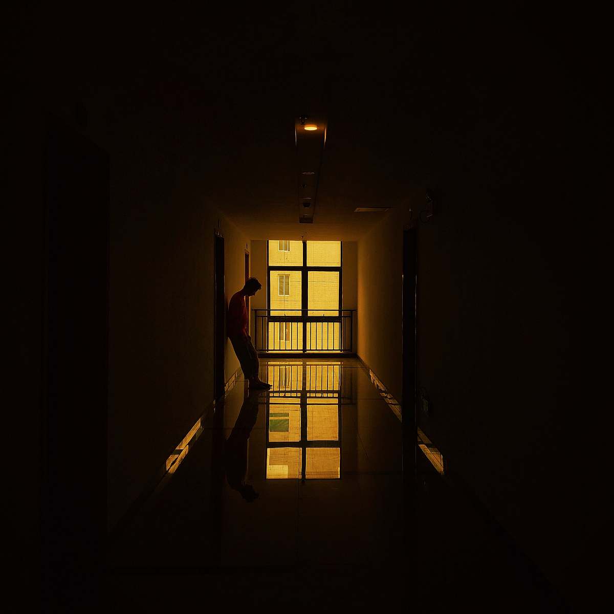 flare man standing beside doorway silhouette