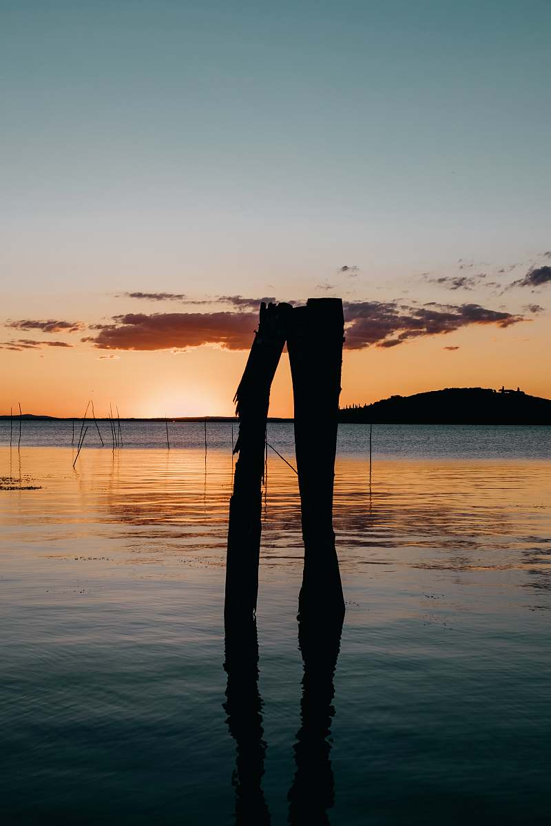 outdoors body of water during golden hour silhouette
