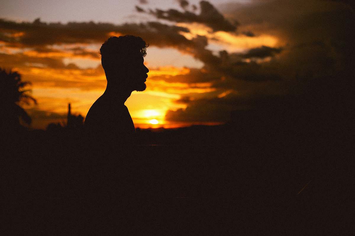 silhouette man's silhouette during sunset sunlight