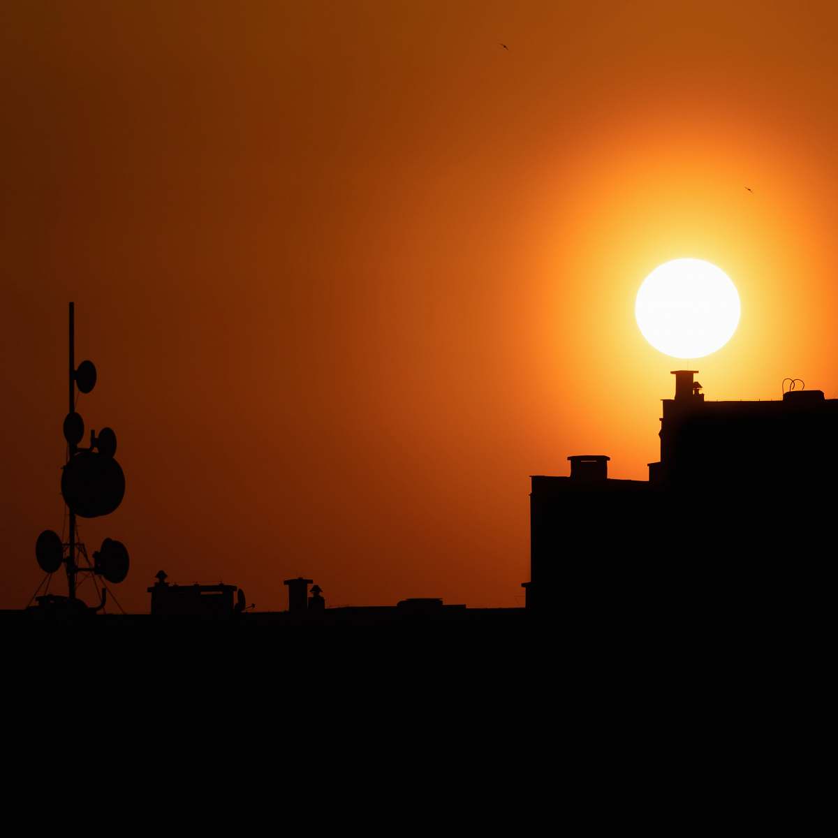 outdoors silhouette of building and satellite dish silhouette