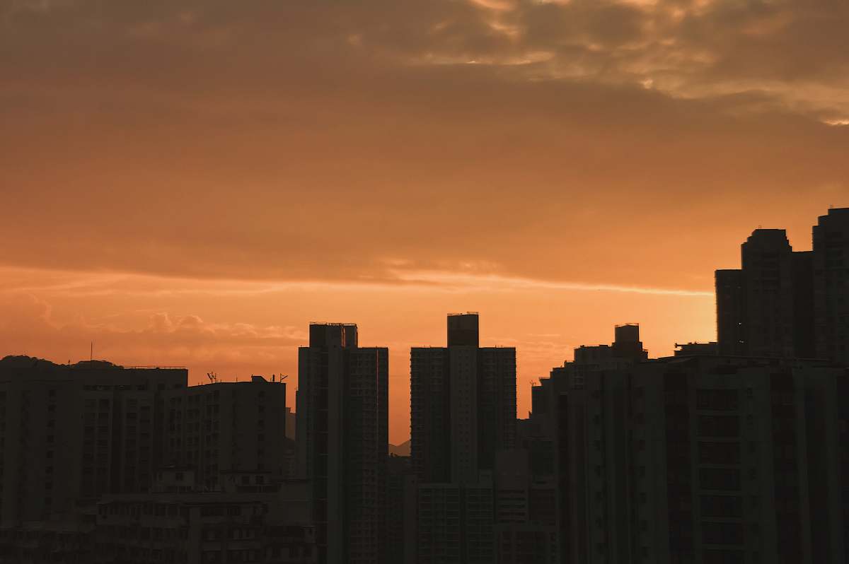 outdoors silhouette of high-rise building during golden hour sky