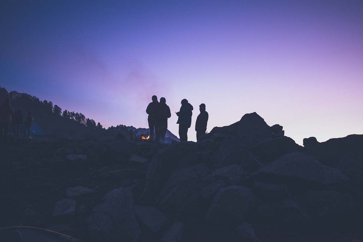 person silhouette of people on mountain during golden hour human