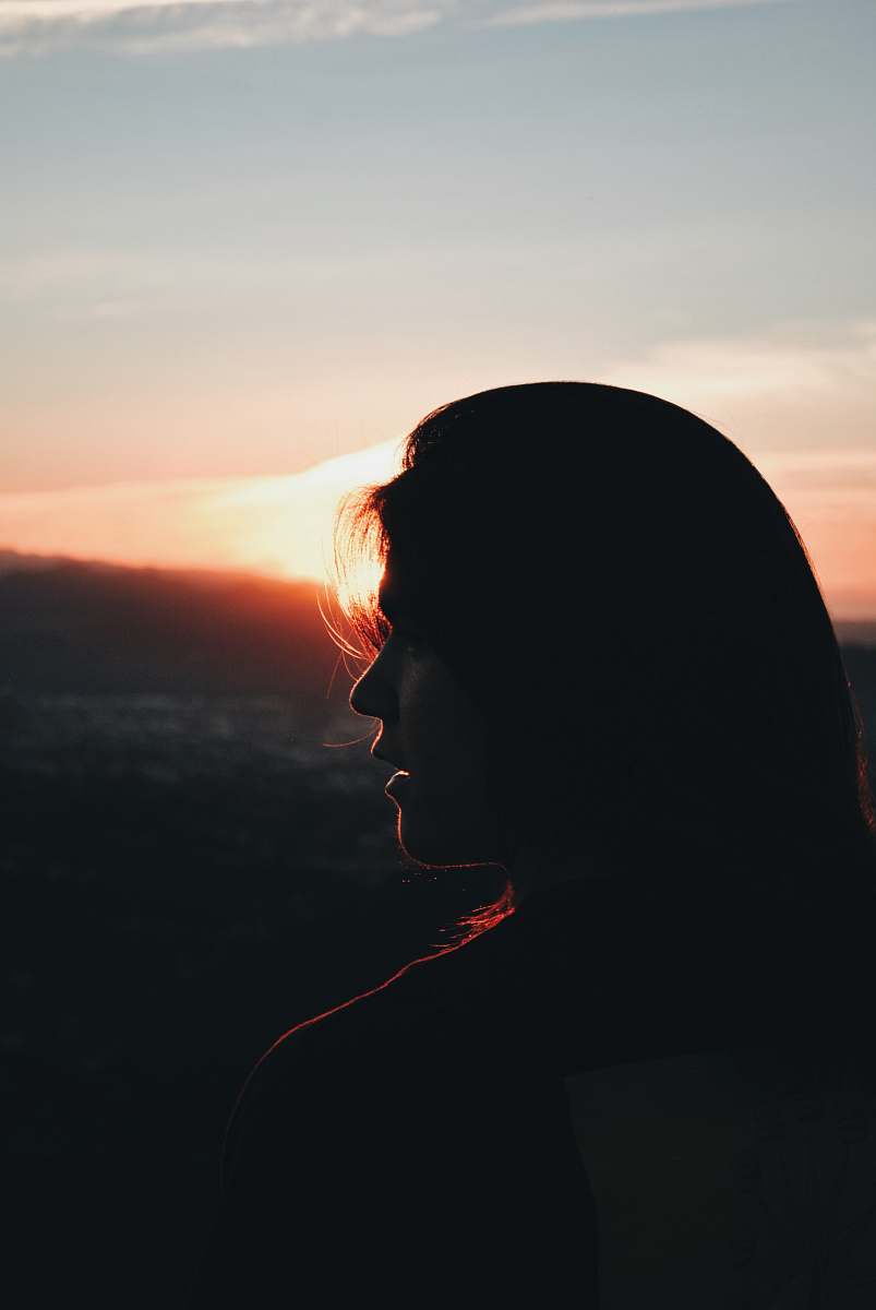 outdoors silhouette of woman facing right during golden hour silhouette