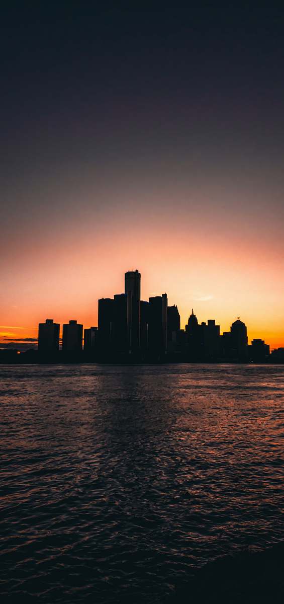 outdoors silhouette photography of building during golden hor red sky