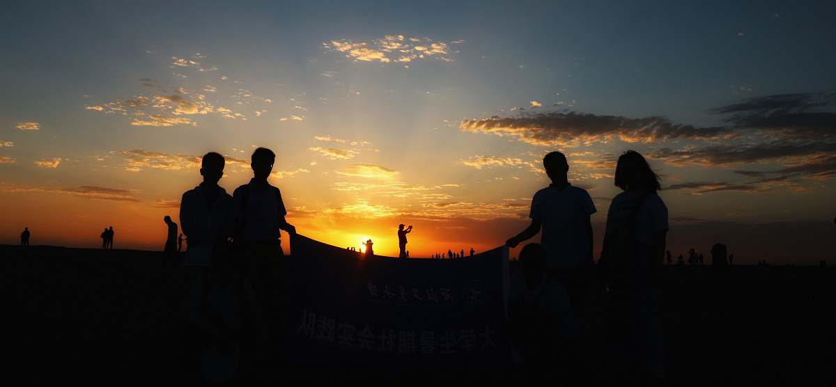 human silhouette photography of people under clear blue sky person