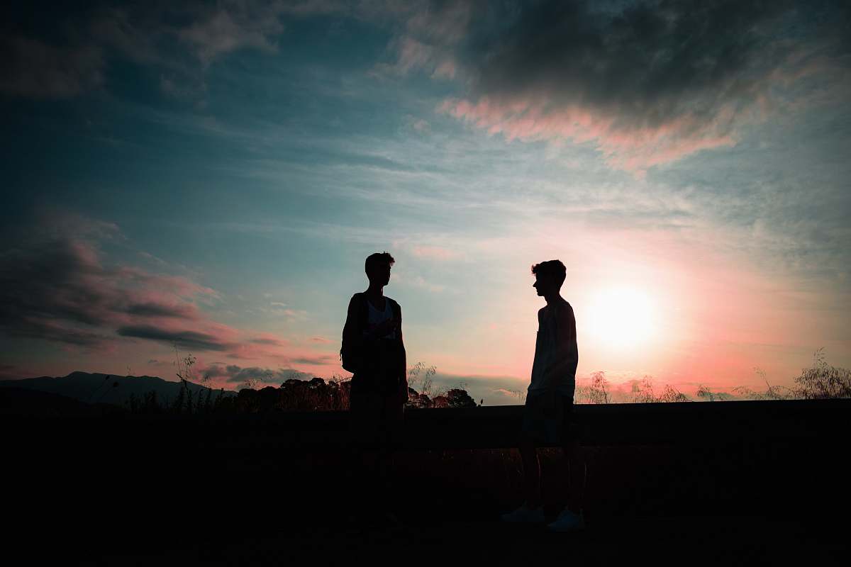 silhouette silhouette photography of two men outdoors