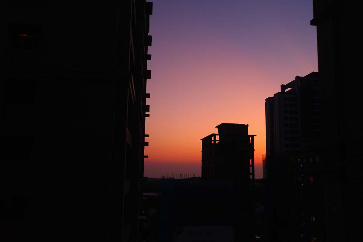 outdoors silhouette view of buildings during golden hour dawn