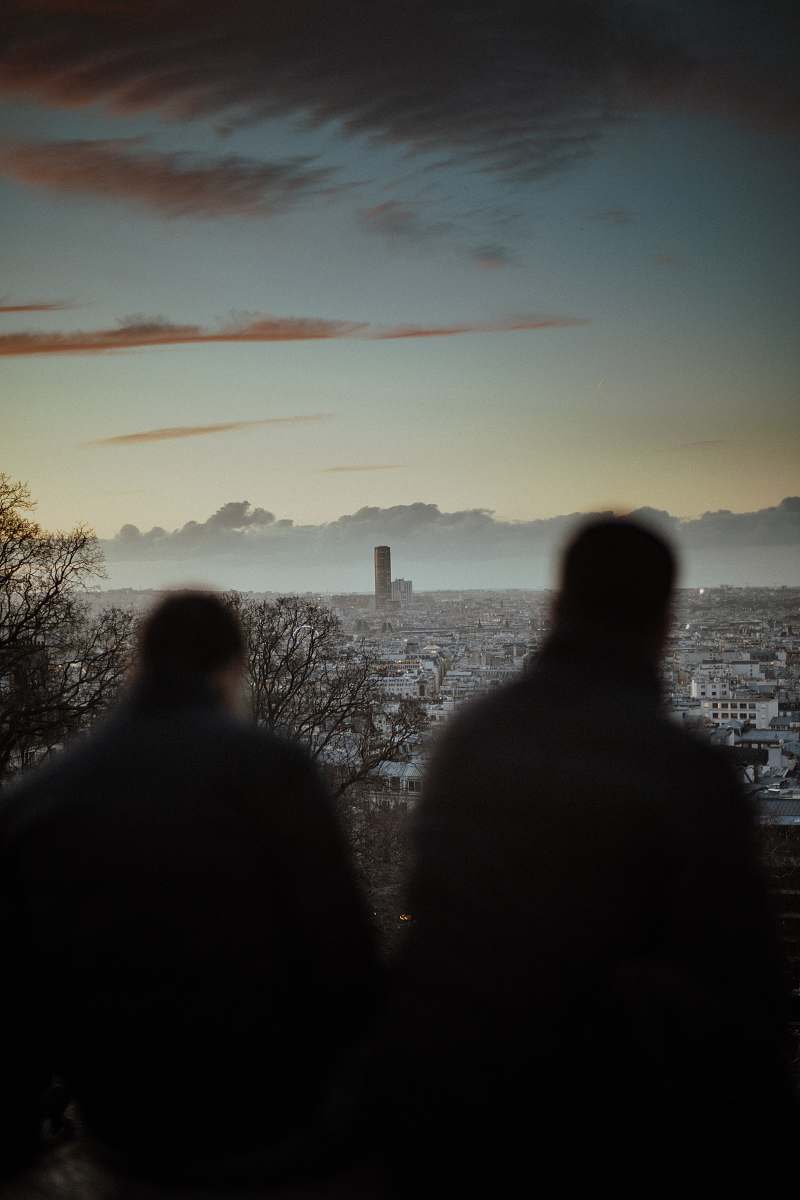 human two man standing beside fence person