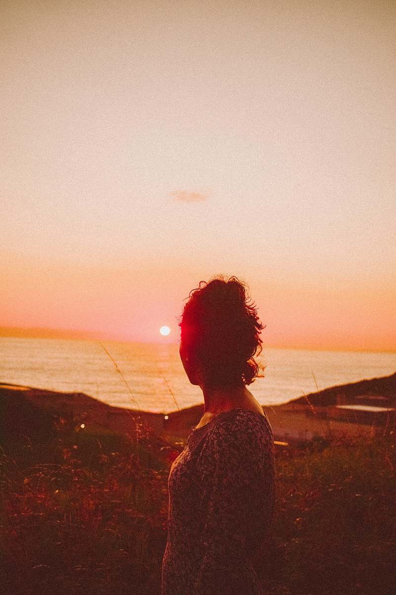 flare woman facing sideways outdoors light
