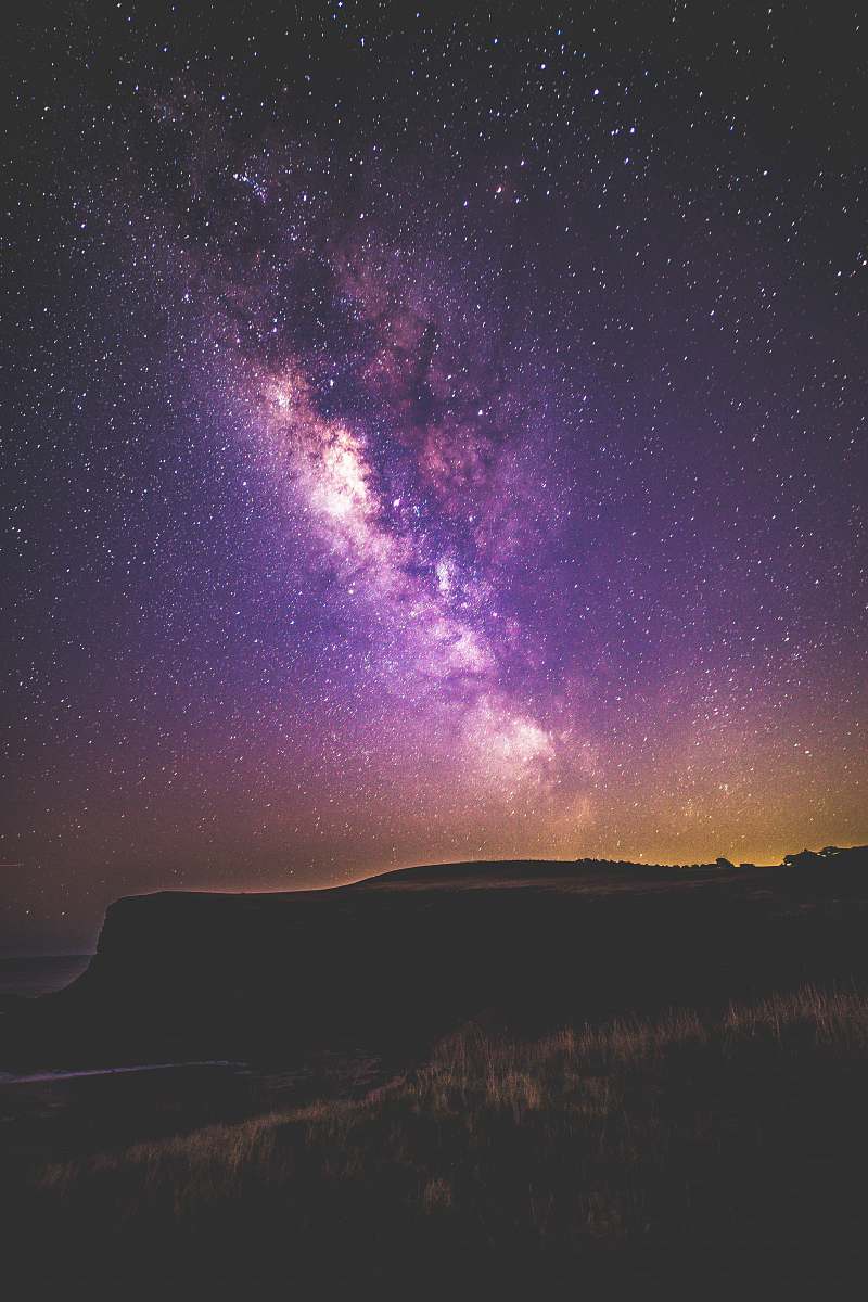 space silhouette of mountain during milky way at nighttime sky