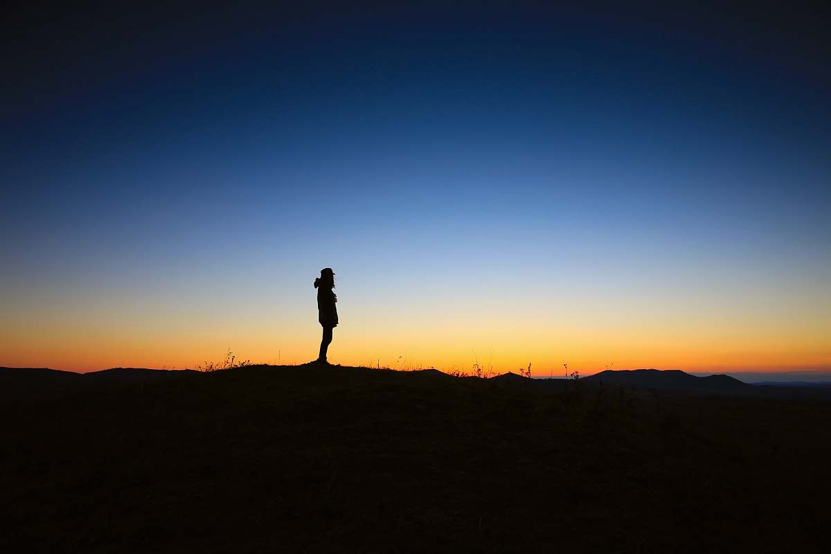 alone silhouette of a person during sunset dusk