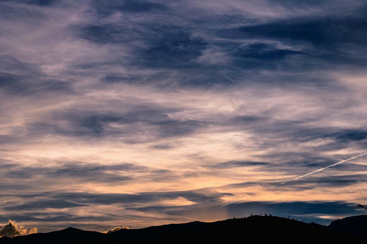 sky silhouette of mountains under blue and white cludy sky cloud