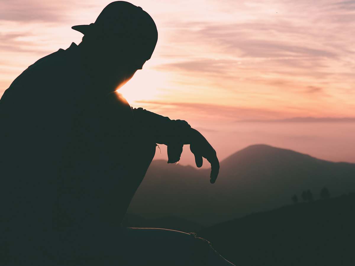 silhouette silhouette of person wearing cap human