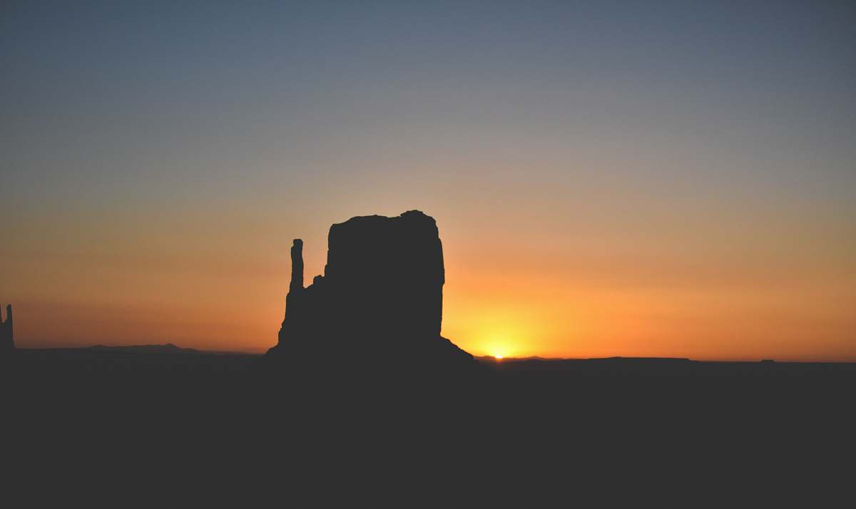 nature silhouette of rock formation during golden hour sky