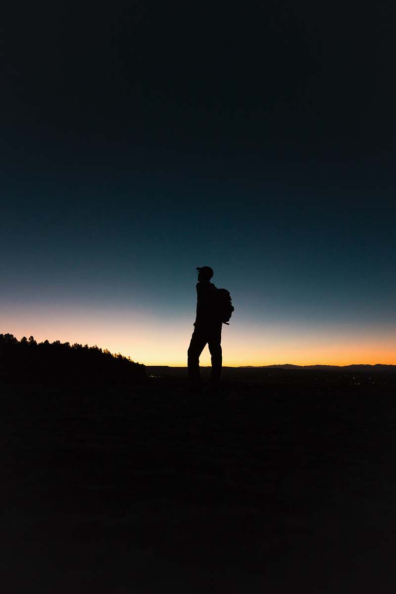 person man with backpack in silhouette human