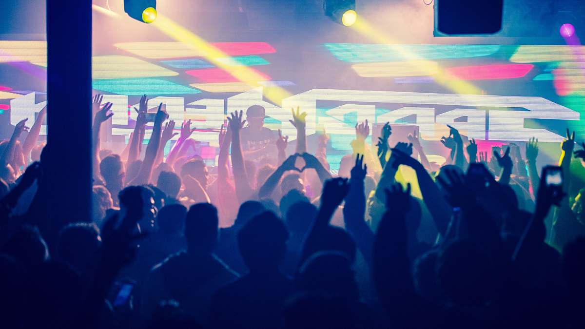 crowd people dancing inside building light