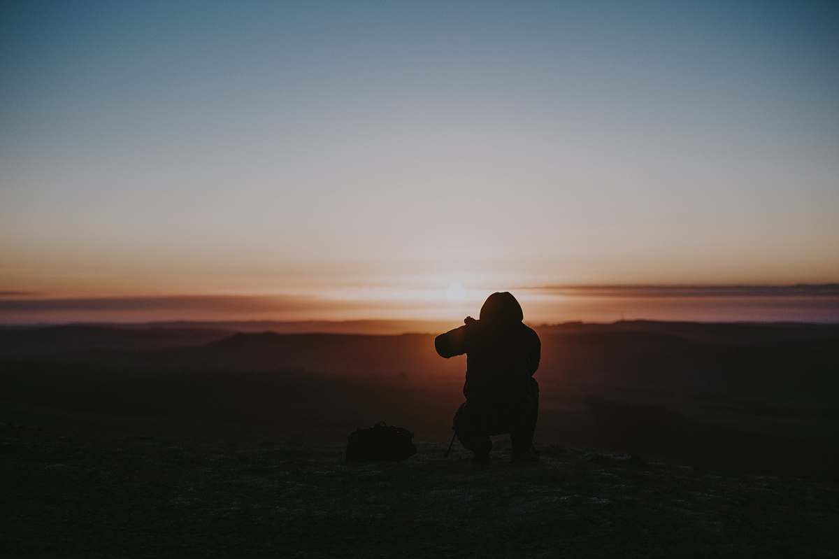 person silhouette of person taking photo human