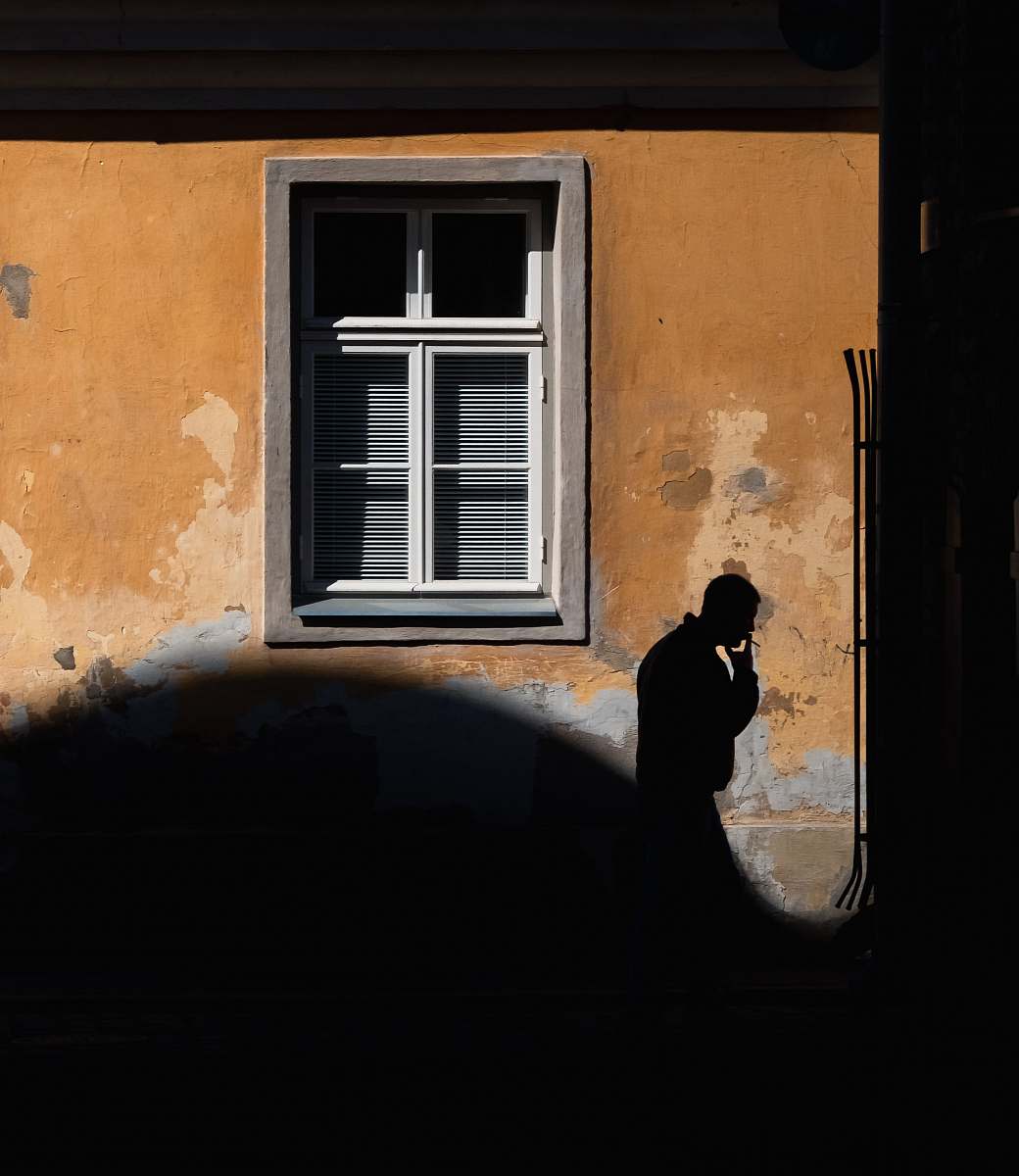 people man passing by the window window