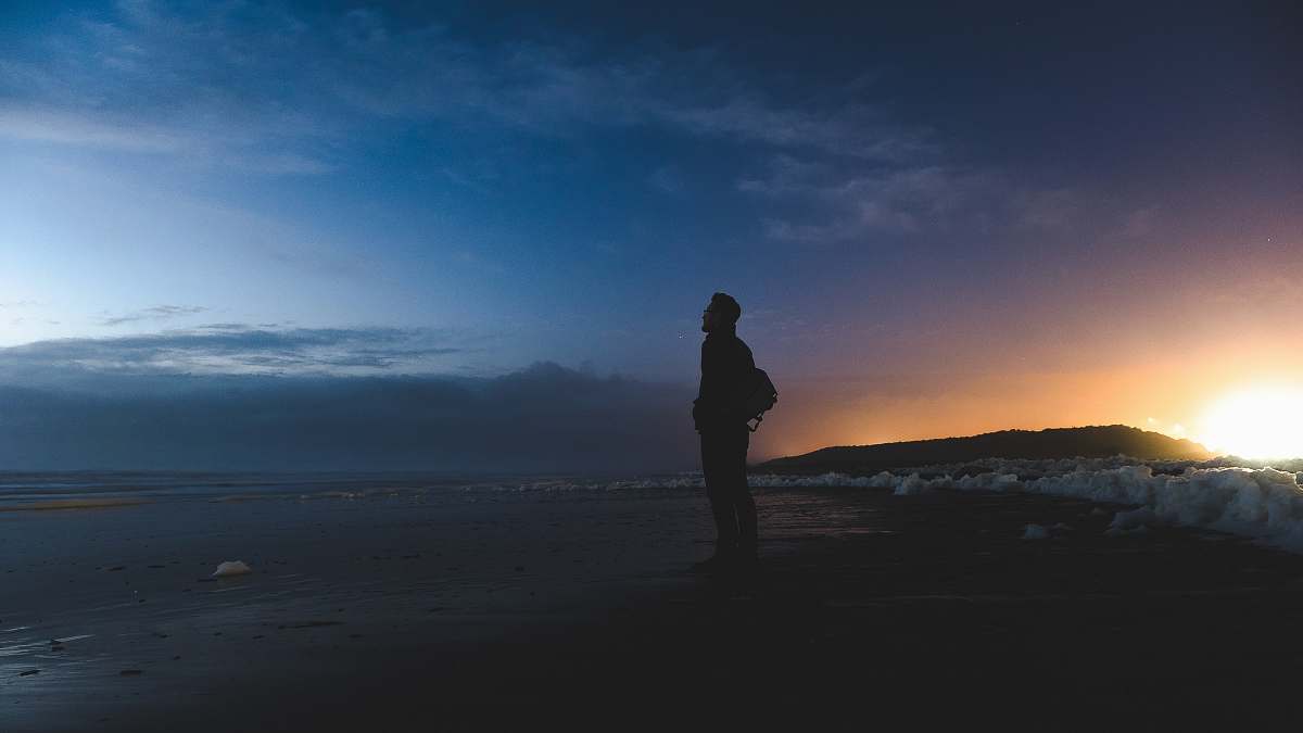 Silhouette Man Standing On Seashore Facing Sea People Image Free Photo