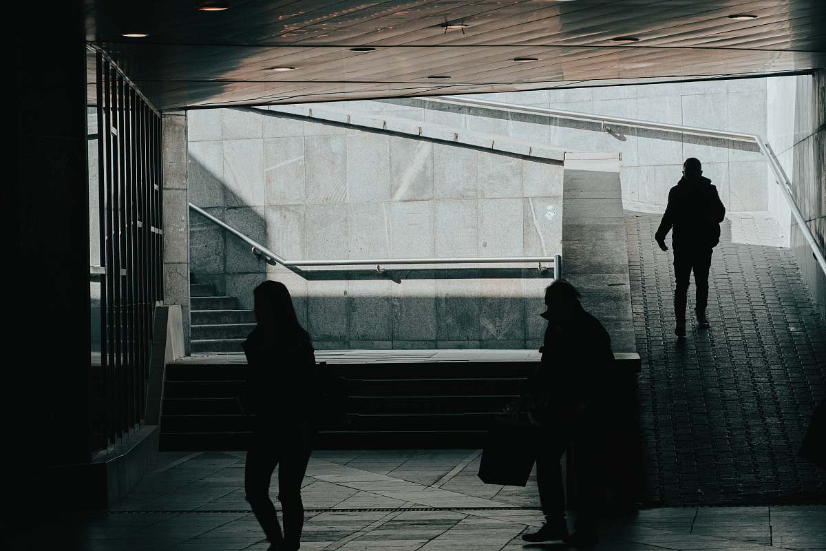 human people walking in dark building pedestrian