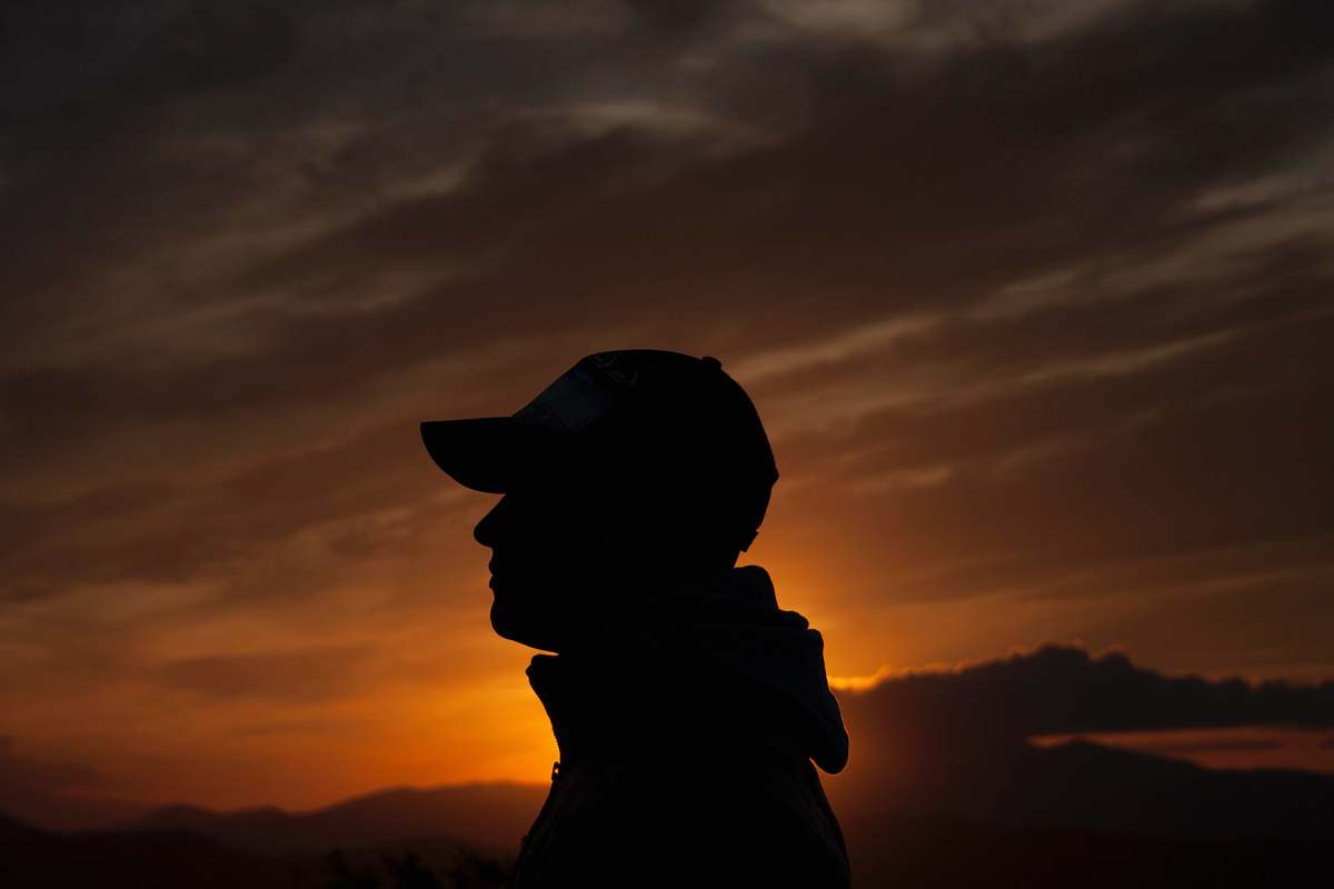 human person's silhouette during golden hour people